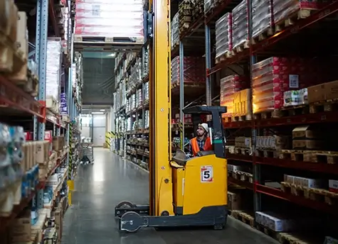 A Worker on a Narrow Aisle Forklift