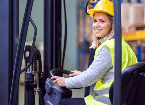 Forklift Operator Smiling While Driving a Forklift