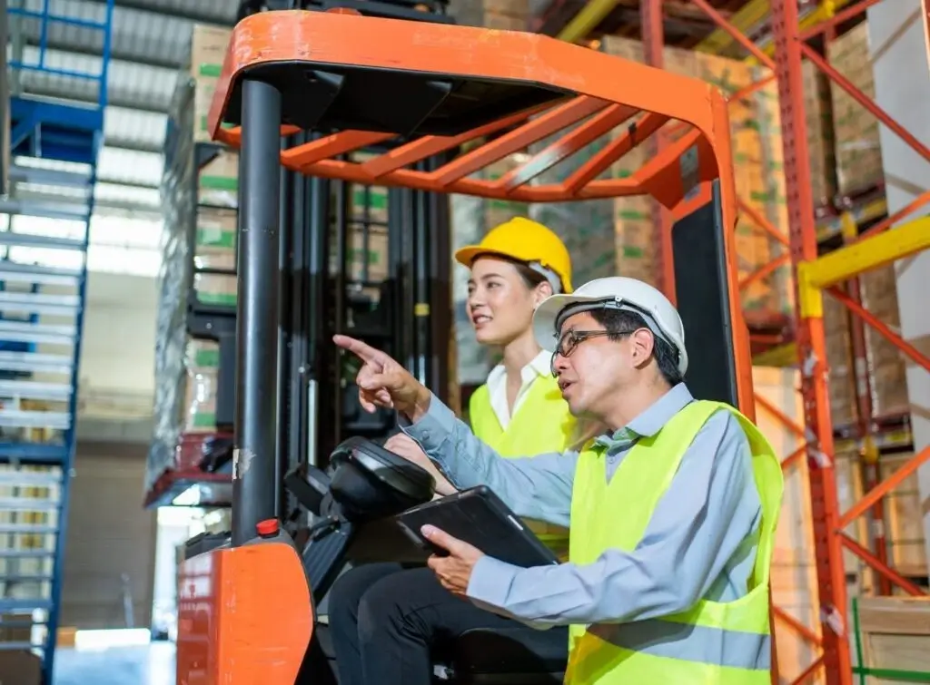 Two Forklift Operators at a Workplace